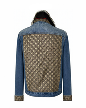 Load image into Gallery viewer, A denim jacket shown from the back, featuring a large beige and brown GG monogram pattern panel across the back, blue denim sleeves and shoulders, and matching monogram pattern on the turned-up cuffs.